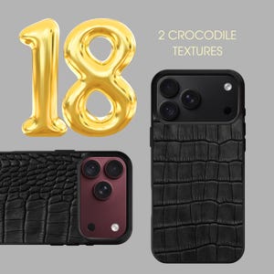 May include: Two black smartphone cases featuring a textured crocodile pattern, displayed alongside a large gold-coloured balloon shaped like the number 18 and the text 2 CROCODILE TEXTURES printed in a light yellow font on a grey background.