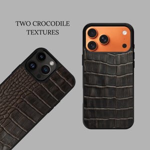May include: Two smartphone cases featuring dark brown crocodile-embossed textures. The text 'TWO CROCODILE TEXTURES' is visible. One case displays a large-scale pattern, while the other shows a smaller-scale pattern with an orange camera housing.