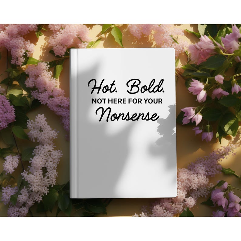 May include: A white book with the text "Hot. Bold. NOT HERE FOR YOUR Nonsense" in black script. The book is surrounded by pink and purple flowers and green leaves on a yellow background.