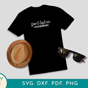 May include: Black t-shirt with the text "Don't test me - I'm in menopause" in white script. A straw hat with a green band and sunglasses are next to the shirt. The image also includes the text "SVG. DXF. PDF. PNG".