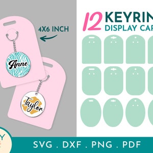 May include: Twelve 4x6 inch blank display cards for keyrings. The cards are light green with two holes at the top for hanging. The text "12 KEYRING DISPLAY CARDS" is printed in pink and black at the top of the cards.