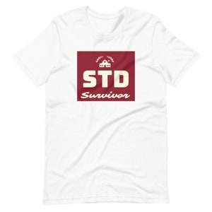 May include: White t-shirt with a red square graphic that says "STD Survivor" in white text with a small house icon and laurel wreath.