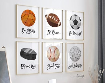 May include: Set of six watercolor illustrations of sports balls with motivational quotes. The illustrations include a basketball, football, soccer ball, hockey puck, baseball, and golf ball. The quotes are "Be Strong", "Be Brave", "Be Yourself", "Dream Big", "Stand Tall", and "Seek Adventure".