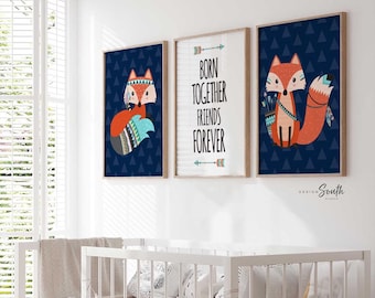 May include: Three framed prints with a blue background and white triangles. The center print features the text "Born Together Friends Forever" with arrows above and below. The left and right prints feature a cartoon fox with a red and orange body, a white chest, and a blue and white patterned tail.