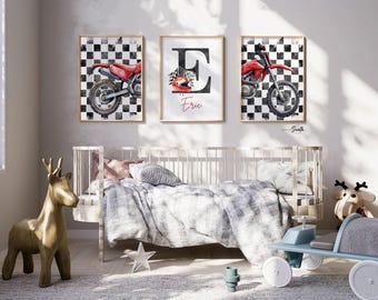 May include: Three framed wall art prints featuring a red dirt bike on a black and white checkered background and a central print with a large letter E, a red racing helmet, and the name Eric written in red script, all displayed in a nursery.
