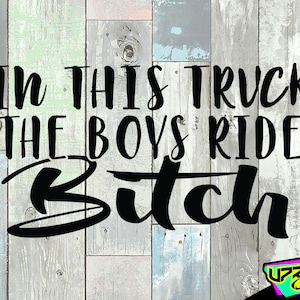 May include: Black and white graphic text on a wood background that reads "In this truck the boys ride Bitch".