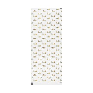 Flat lay of a sheet of wrapping paper featuring Classic Winnie the Pooh and friends playing.