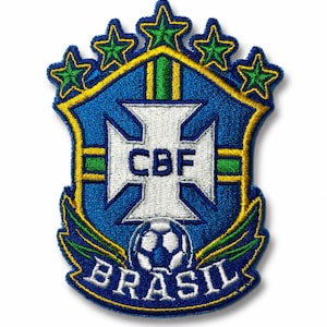 May include: An embroidered patch featuring the Brazilian Football Confederation crest. The shield is blue with a white cross, the letters CBF, and a soccer ball. It is topped with five green stars and bordered in yellow, with the word BRASIL below.