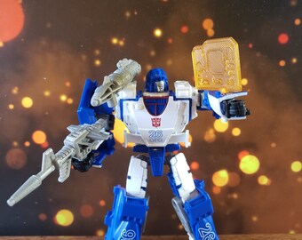 登場! Transformers WFC Kingdom Mirage Shoulder Cannon Adapter デュエルマスターズ