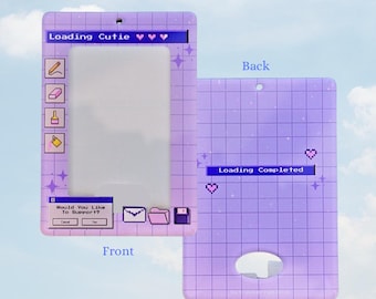 May include: A light purple ID card holder with a grid pattern and the text "Loading Cutie" on the front. The back of the holder has the text "Loading Completed". The holder has a slot for an ID card and a hole for a lanyard.