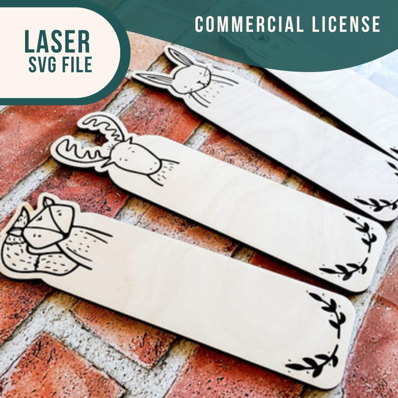 May include: Four wooden bookmarks with different animal designs. The designs include a deer, a rabbit, a fox, and a leafy design. The bookmarks are on a brick background.  COMMERCIAL LICENSE
