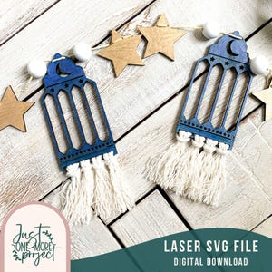 May include: Two blue wooden lanterns with a crescent moon design and white tassels hanging from a string of white beads and gold stars. The image includes the text "LASER SVG FILE DIGITAL DOWNLOAD".