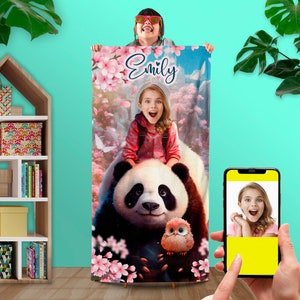May include: A colorful beach towel with a panda bear, a small bird, and a girl riding the panda. The towel has pink flowers and the name "Emily" written on it.
