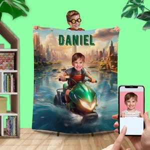 May include: A personalized fleece blanket with a cityscape background and a child riding a green and black ATV. The blanket features the name "Daniel" in green letters.