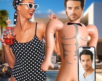 May include: A woman wearing a black and white polka dot swimsuit is holding a glass of red liquid. Behind her is a large inflatable male torso with a man's face on it. The inflatable torso is holding a smartphone with a man's face on the screen.