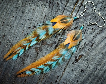 Boucles d'oreilles plumes Boucles d'oreilles plumes bleues Boucles d'oreilles plumes naturelles Boucles d'oreilles amérindiennes Boucles d'oreilles bohèmes Boucles d'oreilles tribales Bijoux ethniques