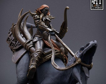 May include: A dark-skinned female figure with red hair rides a dinosaur-like creature. The figure wears a dark leather outfit with gold accents and holds a bow and arrow. The creature is gray and has a long neck and tail. The text "Mist of the Jungle" is printed below the image.