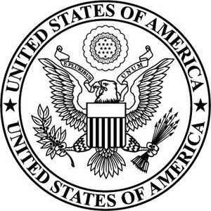 May include: Black and white illustration of the Great Seal of the United States. The seal features an eagle with outstretched wings, holding an olive branch and arrows. The text "UNITED STATES OF AMERICA" encircles the seal.