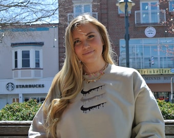 triple nike logo sweatshirt