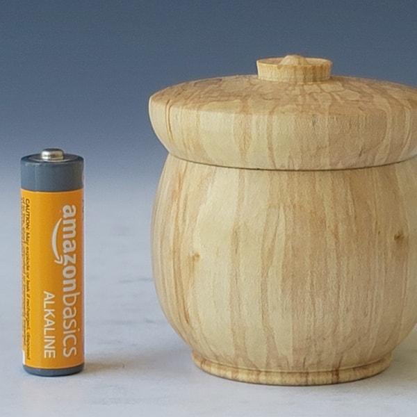 Hand turned round lidded keepsake box made from slightly spalted sycamore wood.