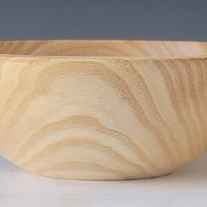 Hand turned olive ash small utility bowl.