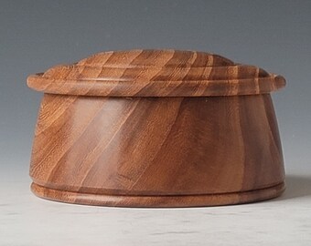 Hand turned lidded box made from red elm wood.