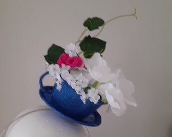 Royal blue cup and saucer headpiece.