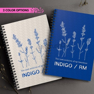 May include: Two spiral bound notebooks with a lavender floral design. The notebook on the left has a cream cover with blue text that reads "The last archive of my twenties INDIGO". The notebook on the right has a blue cover with white text that reads "The last archive of my twenties INDIGO / RM".