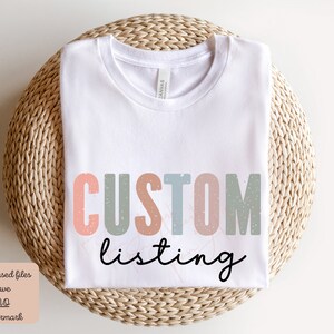 May include: White t-shirt with the text "CUSTOM listing" in colorful, distressed letters. The letters are in shades of pink, blue, and green.