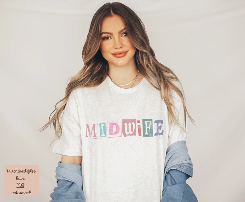 May include: A white t-shirt with the word "MIDWIFE" printed in colorful, block letters. The letters are in different colors, including pink, blue, green, and yellow.