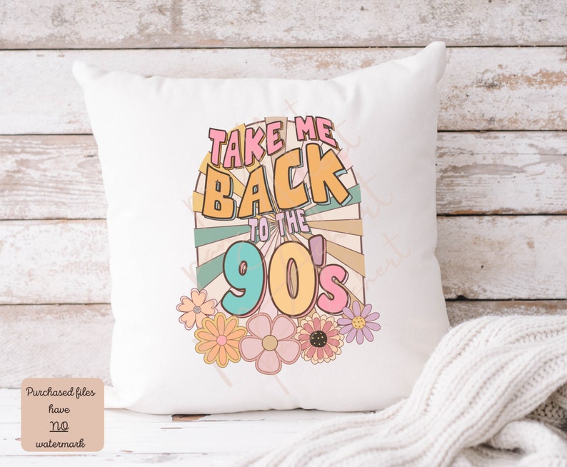 May include: White throw pillow with a colorful graphic design that says "Take Me Back to the 90's" with a retro sunburst design and flowers.
