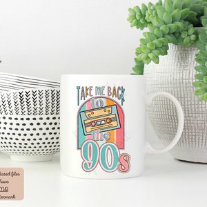May include: White ceramic mug with a colorful graphic design featuring a cassette tape and the text "Take Me Back to the 90s".