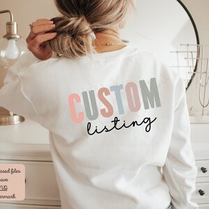 May include: White sweatshirt with the text "CUSTOM listing" in colorful letters with a glittery effect.