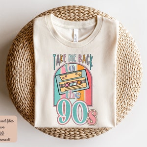 May include: A beige t-shirt with a retro design featuring a cassette tape and the text "Take Me Back to the 90s".
