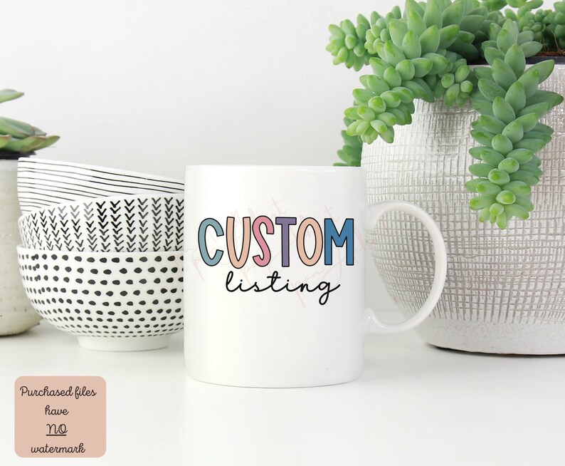 May include: White ceramic mug with a colorful "CUSTOM listing" design. The mug is sitting on a white surface with other bowls and a potted plant.