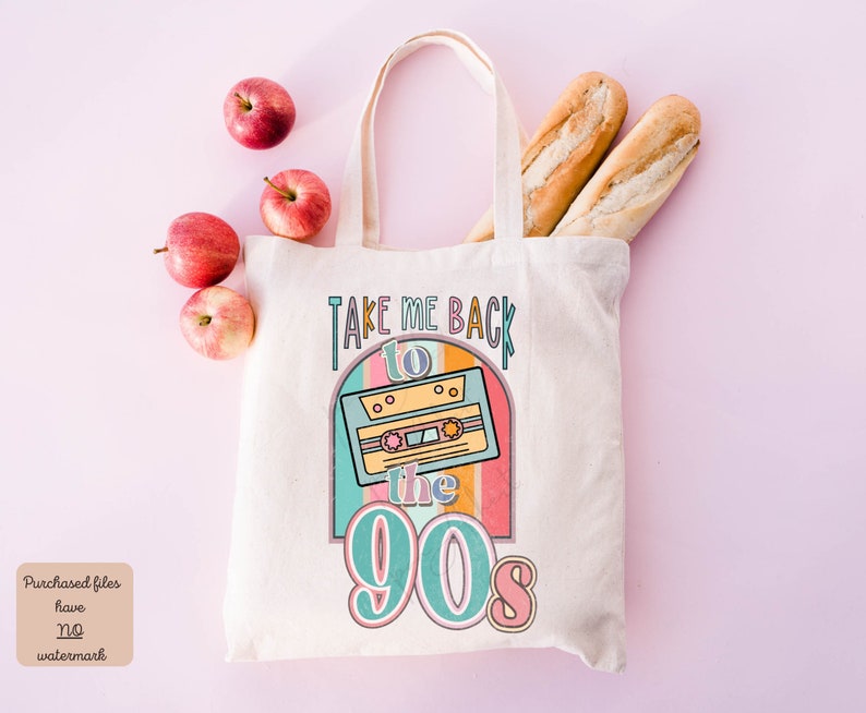 May include: A white tote bag with the text "Take Me Back to the 90s" and a retro cassette tape graphic. The bag is on a pink background with apples and baguettes.