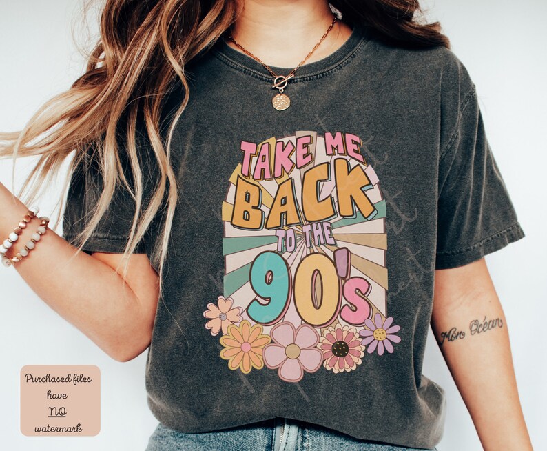 May include: A dark gray t-shirt with a retro-style graphic that says "Take Me Back to the 90's" in colorful letters. The graphic is surrounded by colorful flowers.