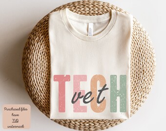 May include: A white t-shirt with the text "Tech vet" in pink, orange, and green with a distressed look.
