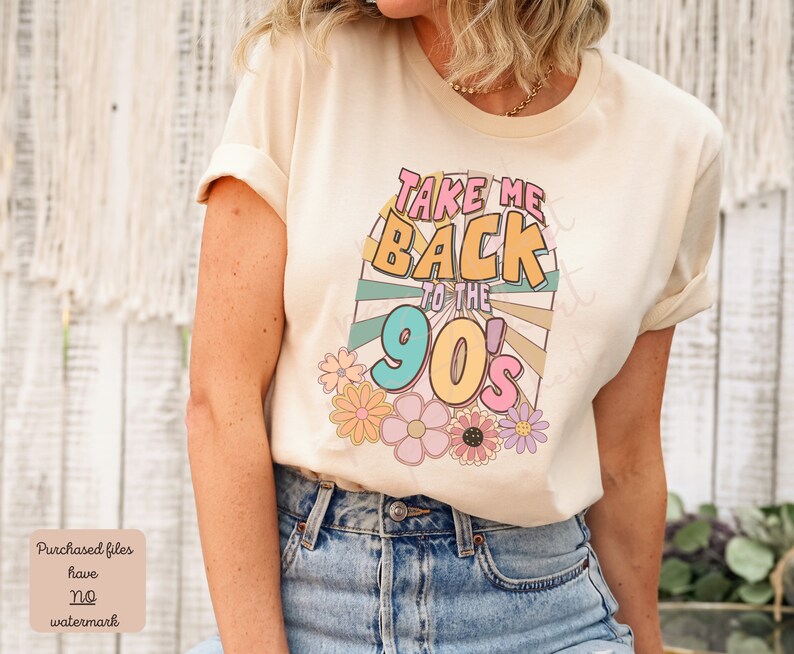May include: A beige t-shirt with a graphic print that says "Take Me Back to the 90's" in colorful retro font with a sunburst design and flowers.