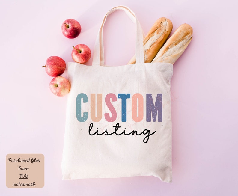 May include: A white tote bag with the text "CUSTOM listing" in colorful letters. The bag is on a pink background with apples and baguettes.