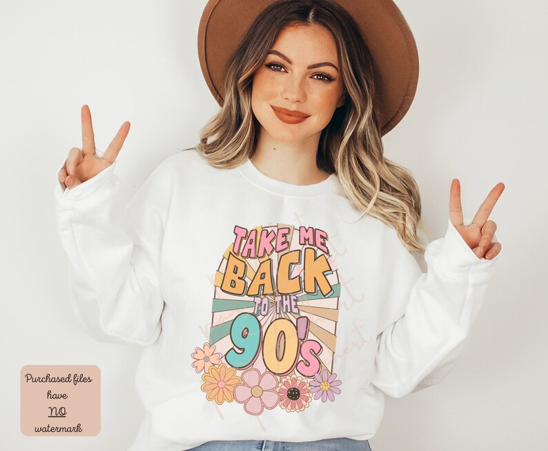 May include: White sweatshirt with a colorful graphic design that says "Take Me Back To The 90's". The graphic features a retro sunburst design with flowers.