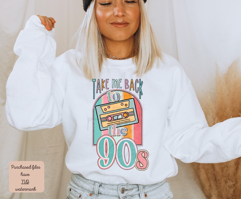 May include: White sweatshirt with a retro-style graphic design featuring a cassette tape and the text "Take Me Back to the 90s". The graphic is in shades of pink, blue, yellow, and green.