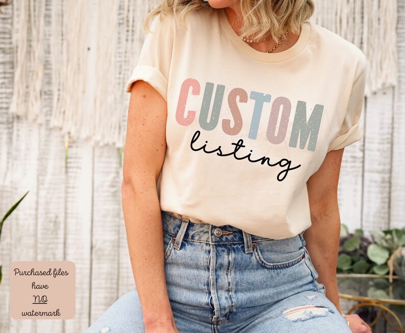 May include: A beige t-shirt with the text "CUSTOM listing" in colorful block letters. The letters are in shades of pink, blue, and green with a speckled texture.