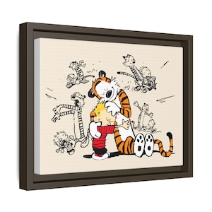 May include: A framed canvas print featuring a cartoon scene of a boy and a tiger. The boy is wearing a red sweater and is being hugged by the tiger. Other cartoon figures are in the background, with black outlines and a beige background.