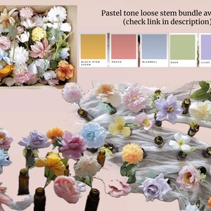 May include: Assortment of pastel colored silk flowers in various styles, arranged on a white fabric surface. The flowers are in small glass bottles with gold tops. The image includes a color chart with the names "Black Eyed Susan", "Peach", "Bluebell", "Sage", "Lilac", and "Peony".