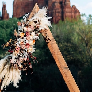Boho wedding arbor / swag flower arrangement / wedding / flower backdrop