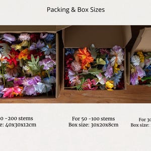 May include: Three boxes filled with colorful artificial flower stems. The boxes are labeled with the number of stems and the box size in inches. The boxes are on a wooden surface.