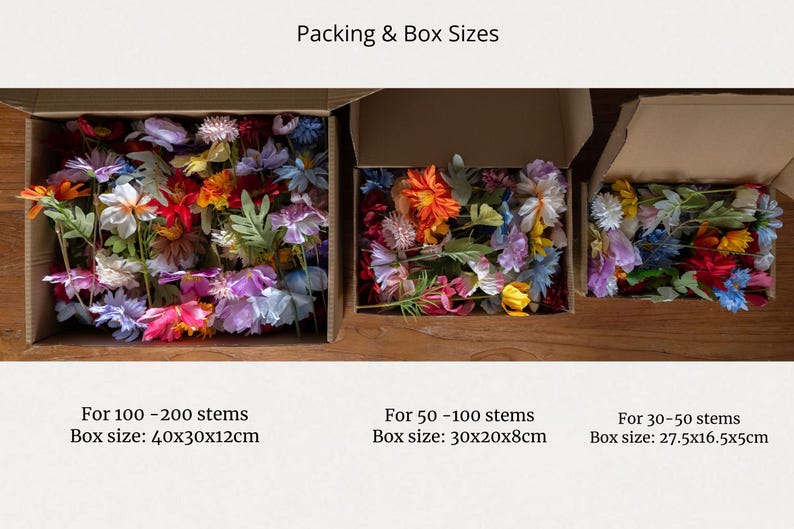 May include: Three boxes filled with colorful artificial flower stems. The boxes are labeled with the number of stems and the box size in inches. The boxes are on a wooden surface.