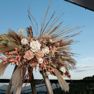 Wedding arch / boho arbor / swag flower arrangement / wedding / flower backdrop