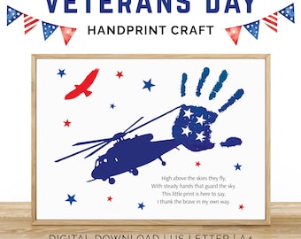 May include: A framed Veterans Day handprint craft print. The print features a blue helicopter, a handprint with stars, and a red eagle. The text reads "Veterans Day Handprint Craft" and a poem. Digital download.